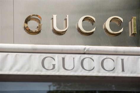 gucci owned by|which company owns gucci.